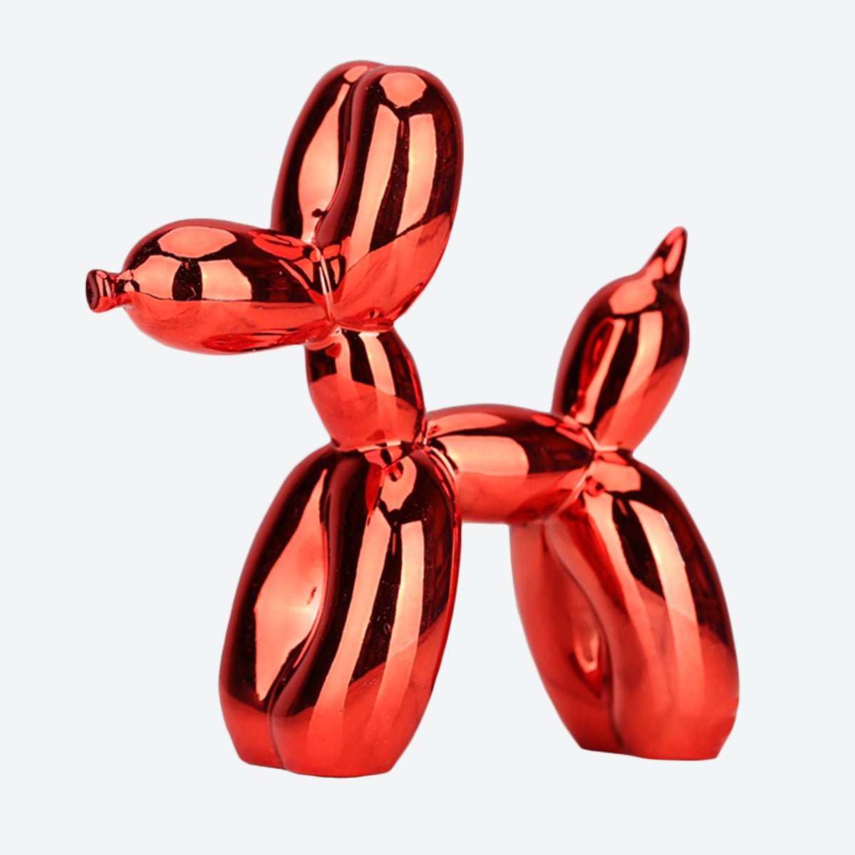 Bold red chrome-style balloon dog statue with a smooth, polished appearance