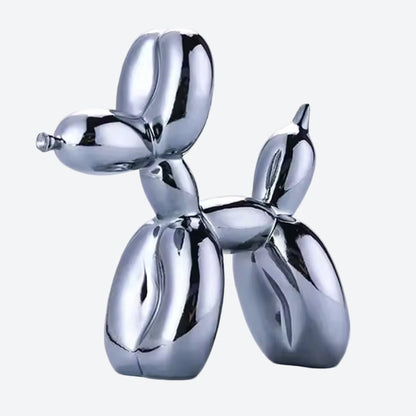 Dark silver metallic balloon dog sculpture with a glossy chrome finish on a neutral background